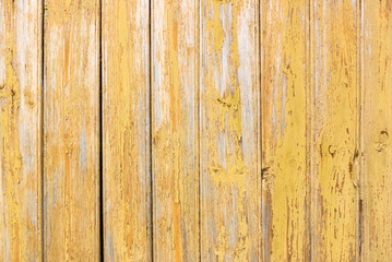 Fototapeta na wymiar Old grey and yellow wooden background with cracks and scratches in vintage style