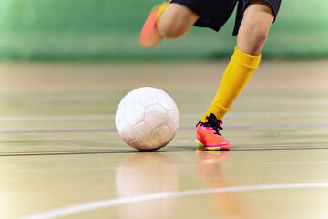 Close-up Image of Futsal Player Kicking Ball. Indoor Soccer Ball Kick. Indoor Football Equipment....