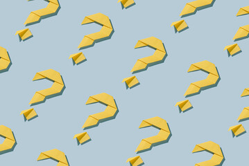 Background pattern of diagonal rows of origami question marks