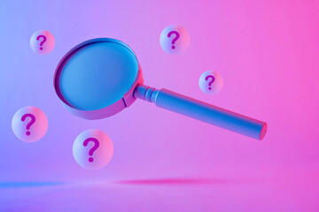 Close-up of a magnifying glass floating between question marks - obrazy, fototapety, plakaty