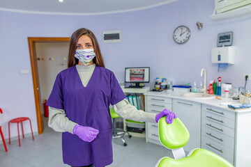 Young female dentist in her dental clinic