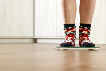Christmas weighing of the body, feet in socks, weight and free space 