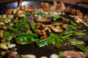 
preparation of typical Valencian paella