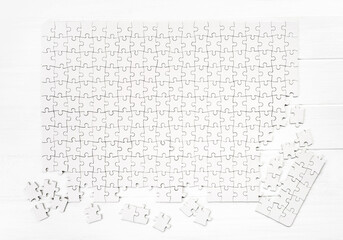 Matching pieces of empty puzzle on white background