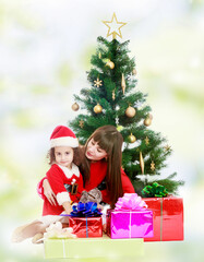 Fototapeta na wymiar Mother with daughter near the Christmas tree