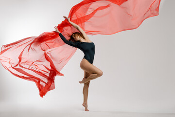Gymnast with red textile