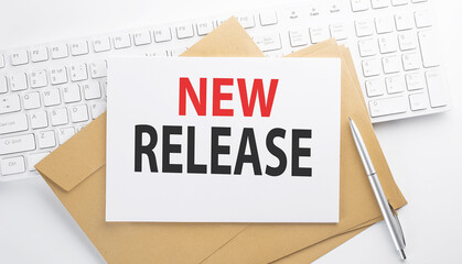 Text NEW RELEASE on the envelope on the keyboard