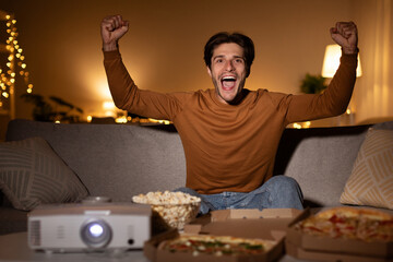 Emotional Guy Shaking Fists Watching Sport Channel Celebrating Victory Indoor