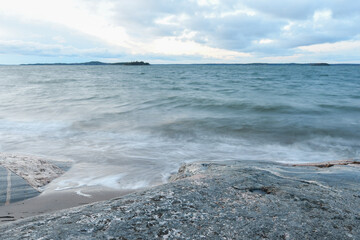 Waves on the beach in the archipelago of Finland in winter