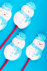 Meringue snowmen. Christmas treats for children. DIY New Year's dessert.