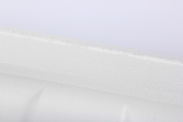 Styrofoam Sheets of different shapes on white background. Pieces of white styrofoam close up. Crumbled styrofoam pieces isolated on white background 
