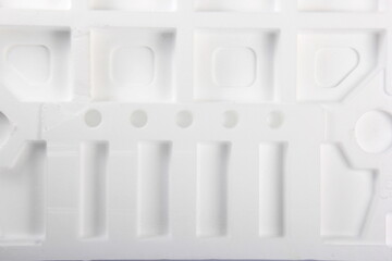 Styrofoam Sheets of different shapes on white background. Pieces of white styrofoam close up. Crumbled styrofoam pieces isolated on white background 