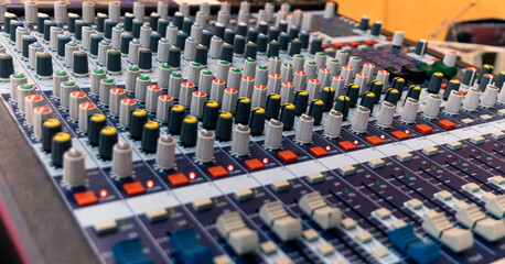 Obraz premium Controls of audio mixing console. Close up. Selective focus