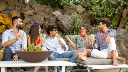 mocktail party outdoor, young and attractive people having fun and following an healthy life style drinking non alcoholic cocktail