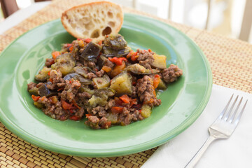 dish of vegetable stew. stewed eggplant, minced meat, carrots, peppers, onion squid