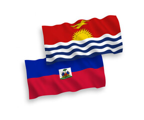 National vector fabric wave flags of Republic of Kiribati and Republic of Haiti isolated on white background. 1 to 2 proportion.