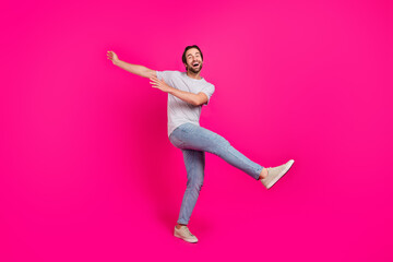 Fototapeta na wymiar Full size profile side photo of young guy good mood fooling dance isolated over magenta color background