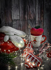 Moscow, Russia, November 2010, Christmas decor, Christmas decorations, a cup with a Christmas pattern, a Christmas tree branch, beads, lollipops and a garland of lights