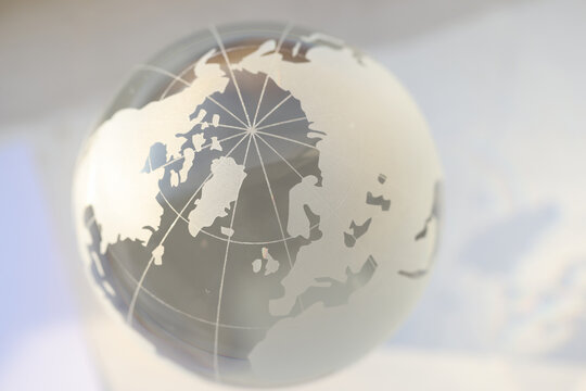 Closeup of glass transparent globe with world map