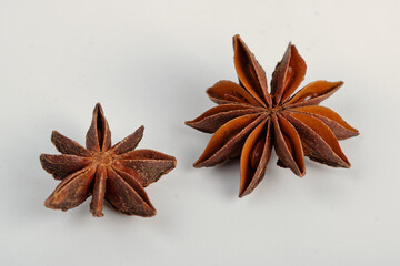 Close-up of star anise isolated on white background. Macro shot with selective focus.
