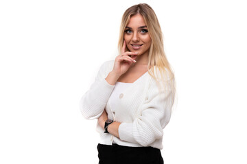 Photo of a beautiful pretty sexy amazing positive smiling happy young blonde woman with makeup in a stylish white knitted sweater and black pants isolated on a white background with copy space for