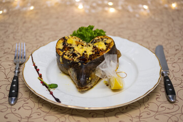 Baked fish stuffed with melted cheese and lemon