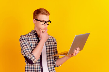 Profile side photo of young handsome man thoughtful minded brainstorming look laptop isolated over...