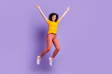 Full body photo of young cheerful girl have fun jump up excited casual outfit isolated over violet color background