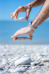 Hands holding stones minimalist abstract 