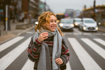 Young woman on a crosswalk in Warsaw, Poland
