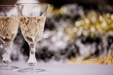 Christmas themed background-two glasses of champagne on a christmas decorated table