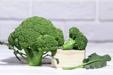 Raw green broccoli on white background, healhy eating diet