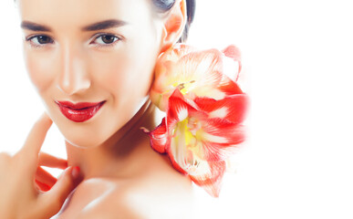 Fototapeta na wymiar young pretty brunette real woman with red flower amaryllis isolated on white background close up