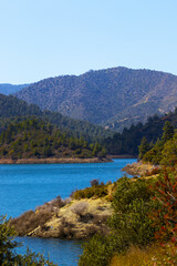 Reservoir near the mountain village in Cyprus in the Troodos mountain, Nature vertical background, Beautiful lake