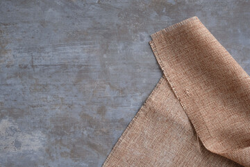 The sackcloth background is laid out on the polished concrete floor.