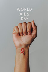 red ribbon and text world aids day