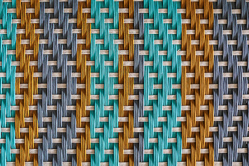 Background pattern covered by  angled coloured interweaving threads 