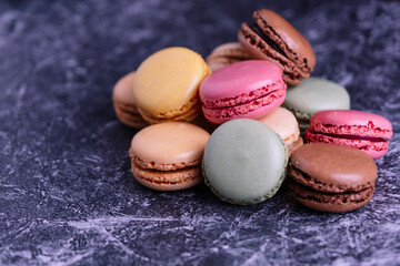 Mountain of macarons of different flavors and colors.