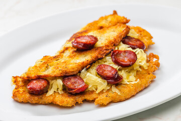 potato pancake filled with cabbage and sausage