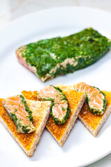 marinated salmon in dill on toast bread