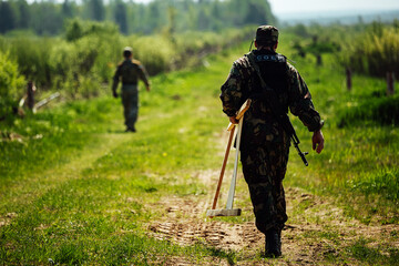 soldiers carry boxes of ammunition and ammunition in their hands - obrazy, fototapety, plakaty