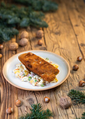 Traditional Christmas dinner in Czech Republic - carp fillet with potato salad