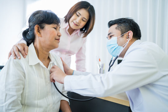 Elderly Asian Woman Comes See The Doctor For A Check-up At Hospital With Daughter As Follower Are Being Examined For Lung And Heart Function Doctors Wear Masks The Idea Take Care Of Elderly Patients