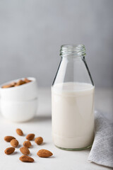 Almond milk in a glass bottle. Selective focus. Alternative milk.