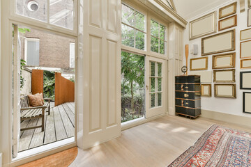 Room with photo frames near terrace