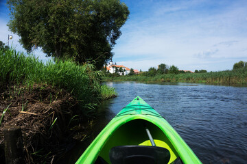 Kayaking on a river. Suprasl river in Poland. Podlasie region summer. Canoe weekend activity. Sunny...
