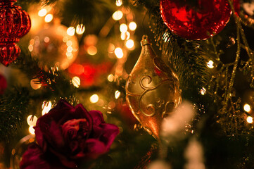 Decorated Christmas balls on the Christmas tree beautiful background bokeh with shadows from a...