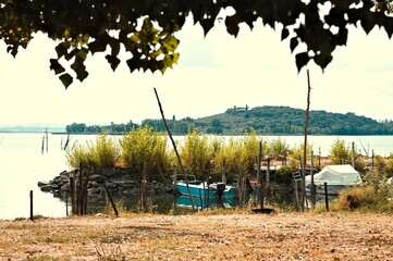 Small boats moored on Lake Trasimeno (Umbria, Italy, Europe) - 470888969