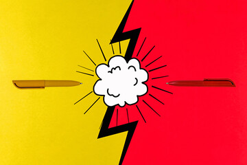 The concept of opposing views, on a bright yellow and red background. Cutting edge of the pen - 470889943