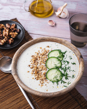 Bowl with soup tarator placed on table